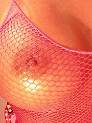 xoGisele rubs hot oil all over her hot body and takes off her tight fishnet bodysuit
